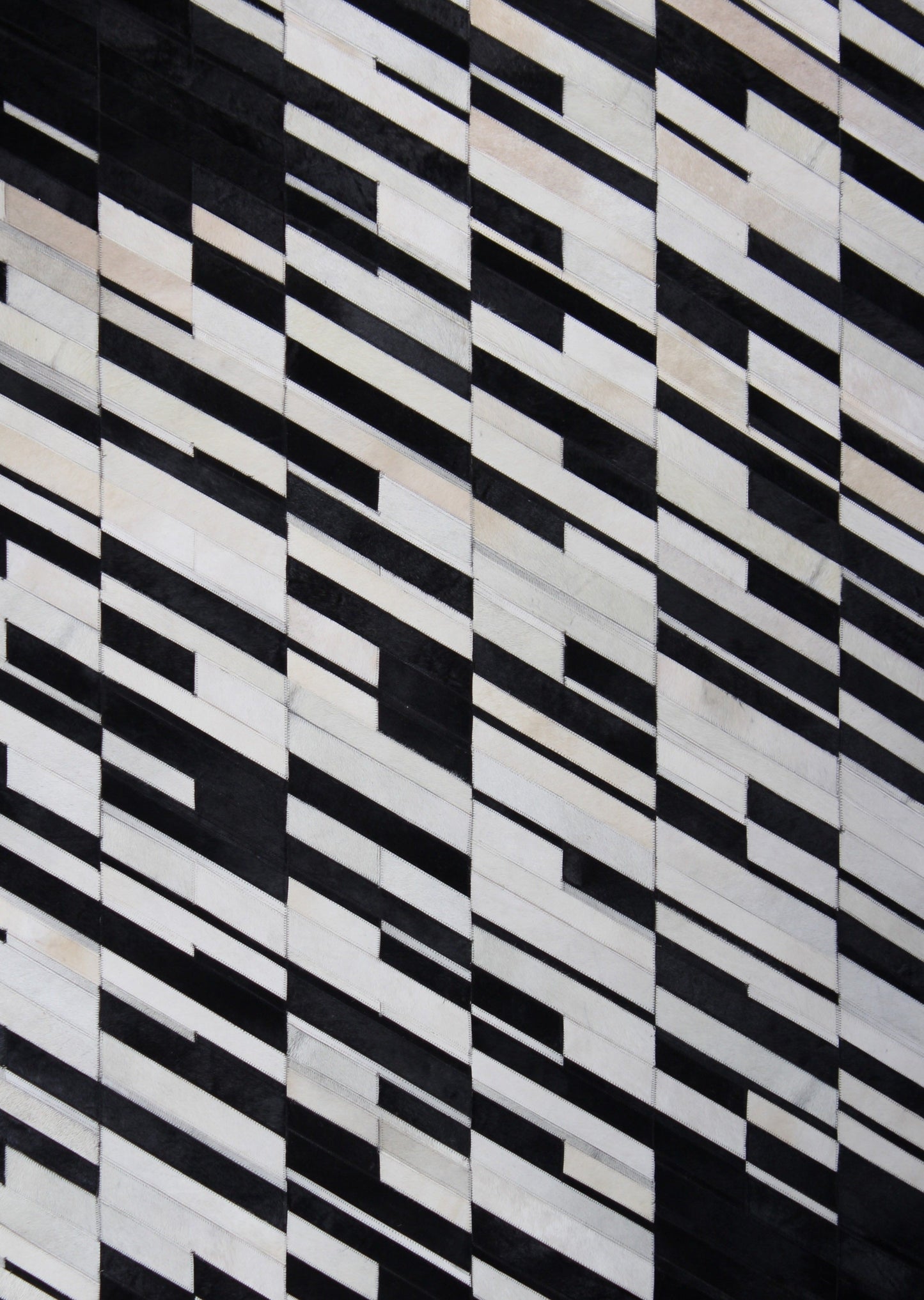 Handmade Black/White Patchwork Cowhide Area Rug