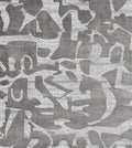 Patterned rug with abstract design in gray tones background