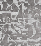Patterned rug with abstract design in gray tones background