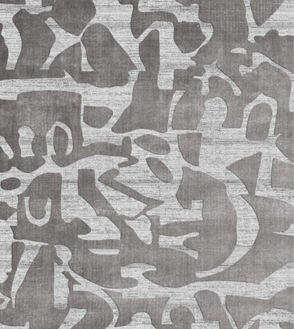 Patterned rug with abstract design in gray tones background