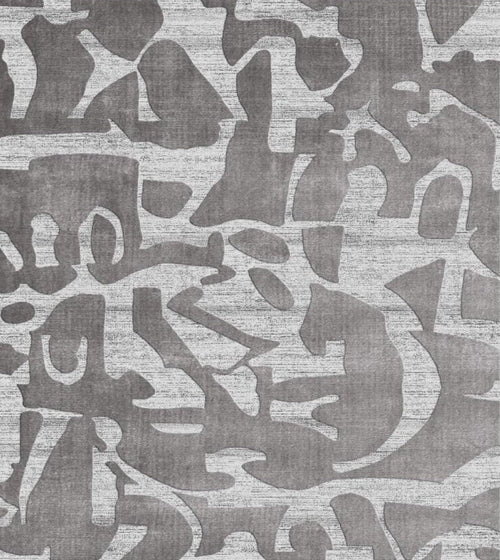 Patterned rug with abstract design in gray tones background