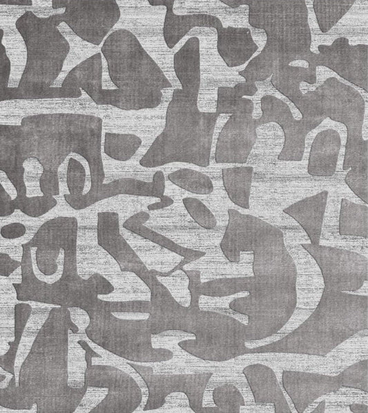 Patterned rug with abstract design in gray tones background