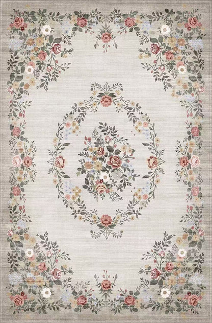 Floral patterned rug with a decorative border on a light background