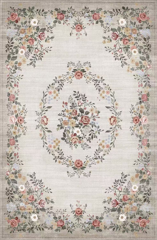 Floral patterned rug with a decorative border on a light background