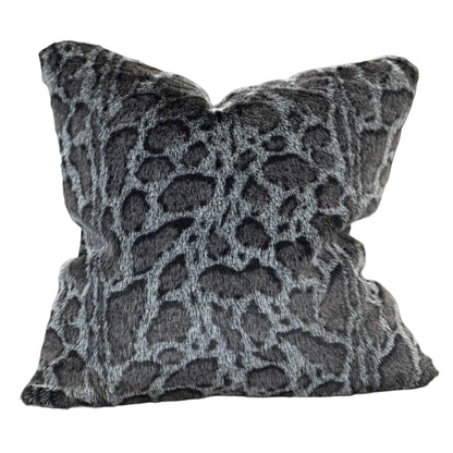 Decorative pillow with a gray and black pattern on a white background