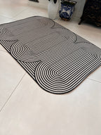 Black & Ivory Geometric Indoor/Outdoor Rug with Organic Live Edge.