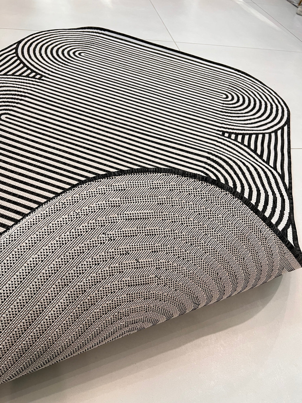 Black & Ivory Geometric Indoor/Outdoor Rug with Organic Live Edge.