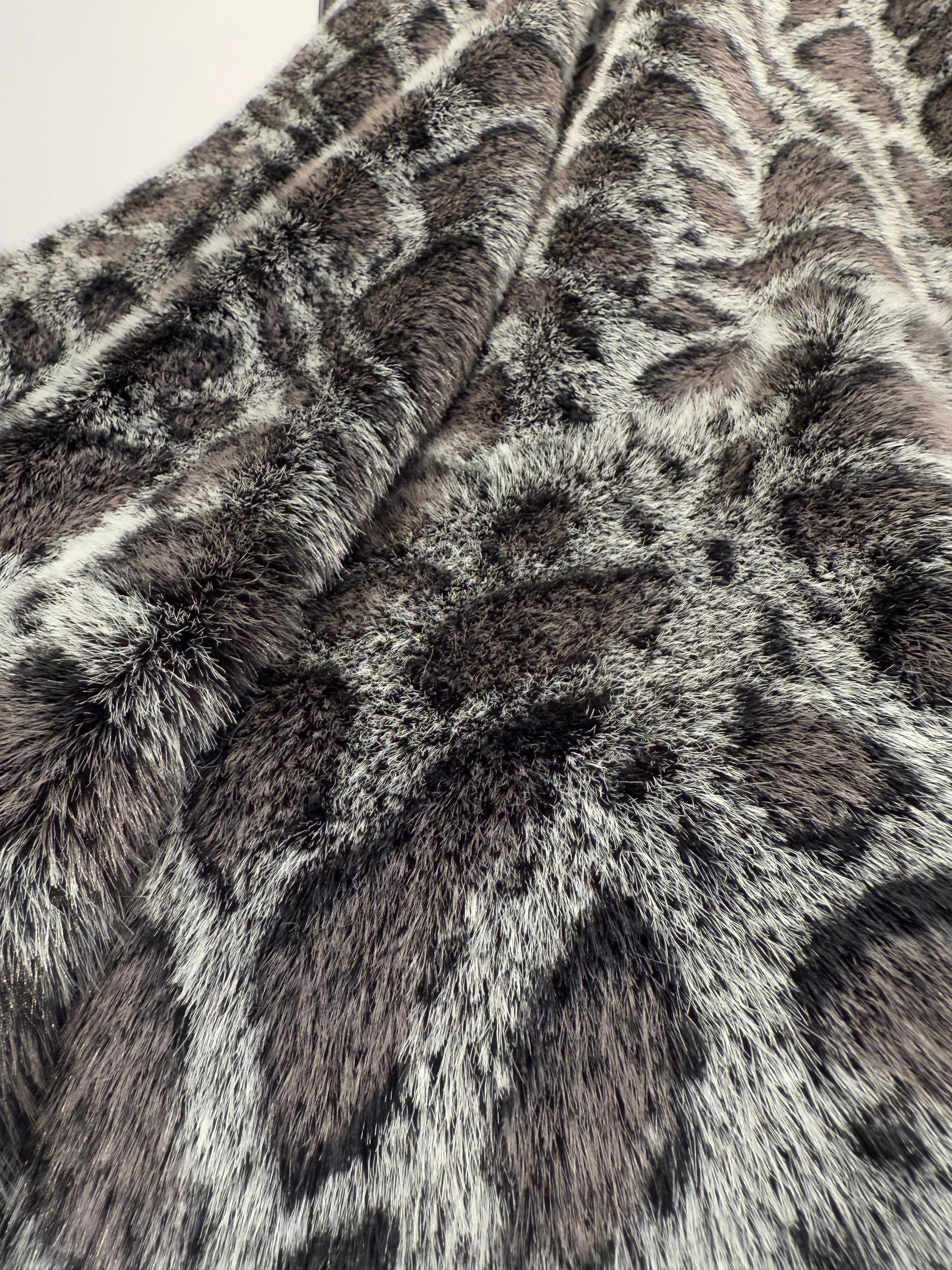Close-up of a fur texture with a pattern resembling a giraffe's coat.