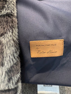 Close-up of a rug with a brand label on a textured surface