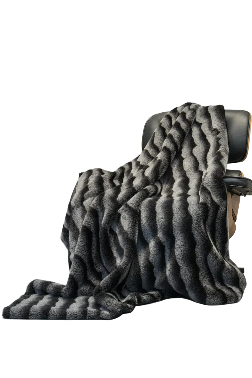 Gray textured blanket draped over a chair on a white background