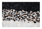 Modern Geometric Cowhide Rug – Black & White with Earth-Tone Checkers – 100% Real - Tikkul Black and White Patchwork Cowhide
